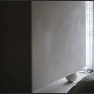 Modern minimalist interior with concrete elements.