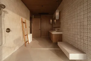 Modern bathroom featuring tiled walls and wooden accents