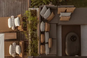 A modern garden design featuring wooden plant beds, a wooden deck, and a wooden floor plan.