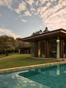A modern house with large glass windows.