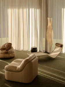 Contemporary living room with pastel-colored furniture and a sleek, modern design.