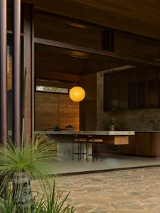 Modern kitchen featuring stone counters and minimalist design elements.