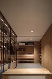 Modern, minimalist wardrobe with light wood finishes and glass cabinets.