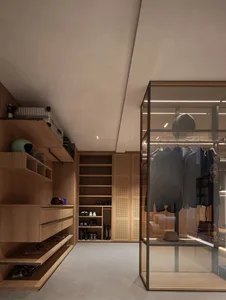 A minimalist clothing boutique featuring wooden shelves and glass walls.