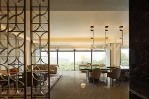 Modern dining room interior design featuring marble and glass materials.