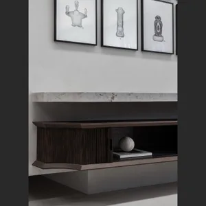 Modern interior design featuring a concrete and marble living room console with minimalist furniture and abstract art.