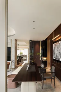 Modern living room featuring wood paneling and contemporary furniture.