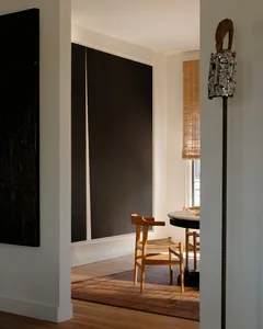 Modern residential dining room with wooden furniture and minimalist design