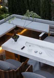 Outdoor patio with industrial design features made of marble.