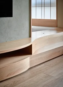 Modern flat with wooden flooring and minimalist design elements.