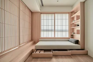 Minimalist bedroom with a floating bed, wooden shelves, and translucent sliding doors.