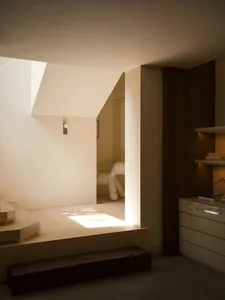 A minimalist interior space featuring wooden elements
