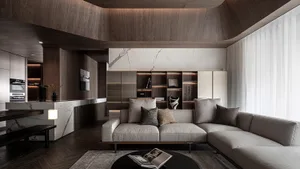 Contemporary living room with modern furniture and marble accents.