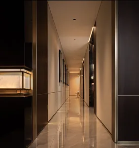 Modern residential corridor featuring shiny marble flooring and minimalistic decor elements.
