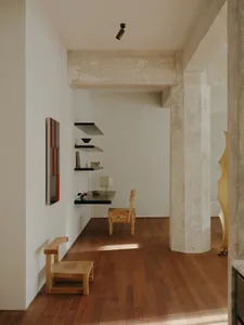 Minimalist office interior with wooden furniture and concrete wall