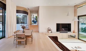 Modern minimalist living room with wooden furniture and glass elements