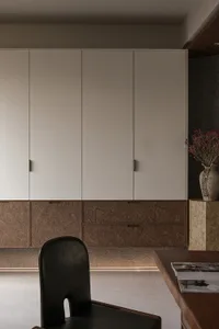 A modern office space featuring minimalist furniture and sleek materials.