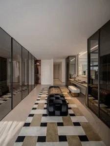 Modern luxury closet featuring marble flooring and walls