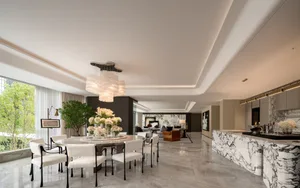 Modern residential kitchen featuring a marble countertop and glass elements.