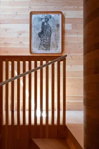 Modern interior design featuring wooden stairs with lighting and interior lighting.