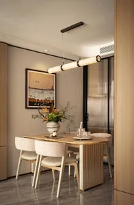 Modern dining room with marble table, wood chairs, and fabric seating.
