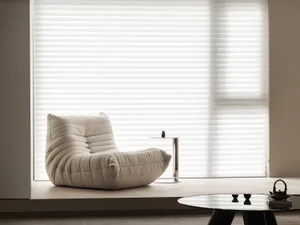 Modern minimalist living room featuring comfortable fabric seating and minimalist decor.