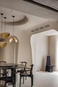 Modern interior design featuring metallic pendant lights.