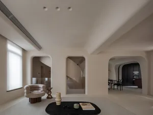 Modern living room with neutral tones and minimalist design.