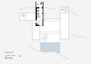 A modern floor plan on paper showing a bedroom and a solarium on the first floor.