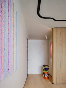 A modern interior featuring colorful abstract art on the wall.