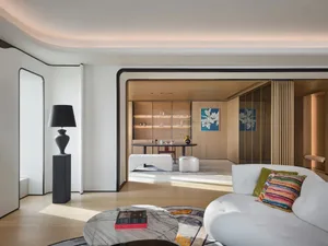 Modern living room featuring wood and marble materials and contemporary design elements.