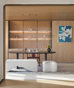 Modern living room with a tea and dining setup featuring wooden shelves and furnishings.