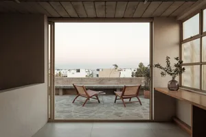 Modern interior design featuring concrete and wood materials.