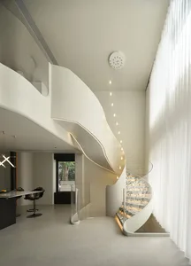 Modern interior design featuring marble, glass, and concrete materials.
