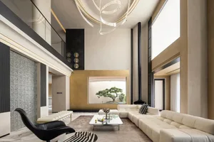 Contemporary living room with concrete walls, white sofa, and black accent chair.