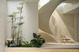 Modern minimalist staircase with decorative elements and soft lighting.
