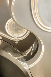 A sleek, modern staircase with glass circular elements and minimalistic design features.