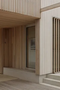 Close-up of a modern architectural detail featuring wooden materials and clean lines.