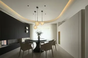 Modern dining room featuring metallic pendant lights