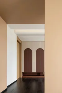 A modern, minimalist wardrobe with wooden elements and arched details.