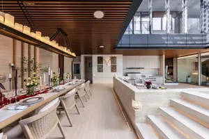 A modern residential interior with a concrete floor and minimalist design elements.