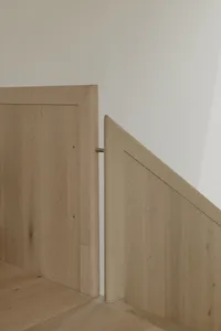Modern wooden stairs with a minimalist design.