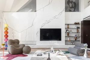 Modern living room with marble accents and contemporary furniture