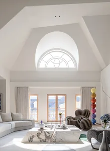 A modern living room featuring marble flooring, concrete walls, and steel accents.
