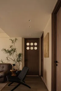 A modern living room with wooden furniture and a minimalist design aesthetic