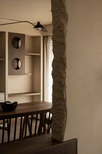 Modern residential interior featuring wooden furniture and stone accents
