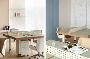 A modern minimalist office space featuring a terrazzo table and chairs.