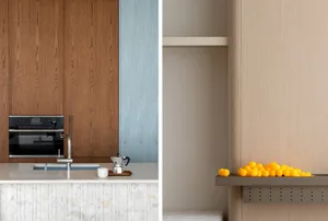 Modern kitchen featuring a marble and terrazzo countertop, sleek cabinetry, and contemporary fixtures.