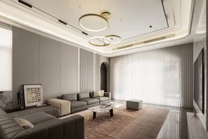 A modern living room with neutral-toned furniture, a minimalist design, and large windows.