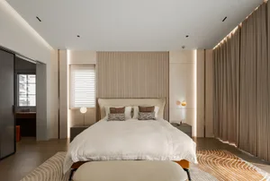 Modern minimalist bedroom with a wooden headboard and wall。